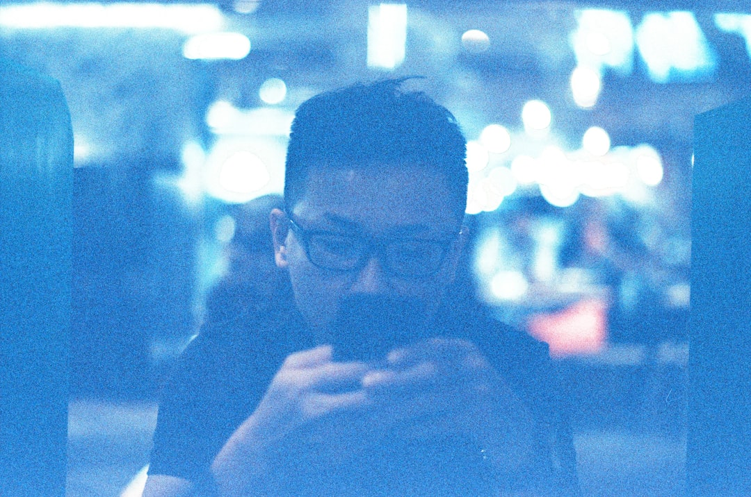 a man is looking at his cell phone