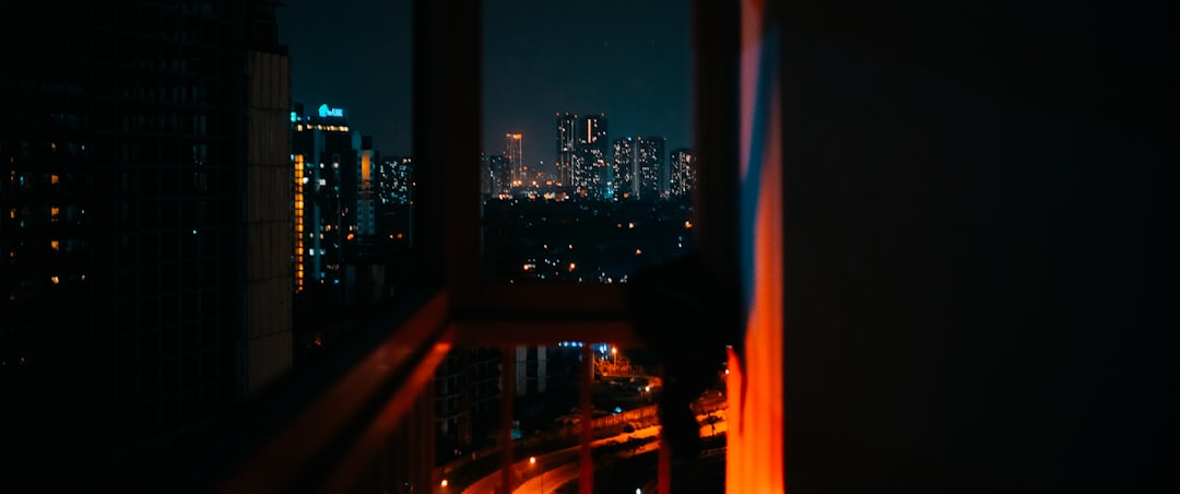 A view of a city at night from a window