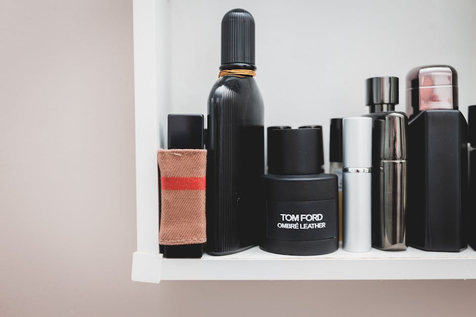 Stylish collection of designer perfumes on a shelf, showcasing luxury and elegance.