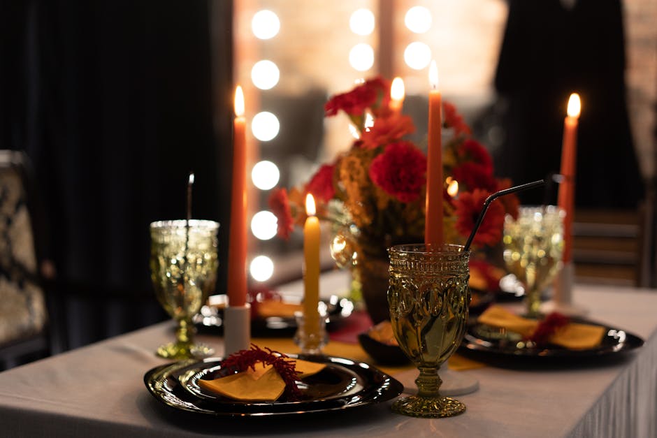 A beautifully arranged table setting with candles and flowers, perfect for elegant dining.
