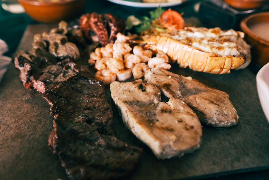 A mouthwatering platter featuring grilled meats and seafood, perfect for a gourmet meal.