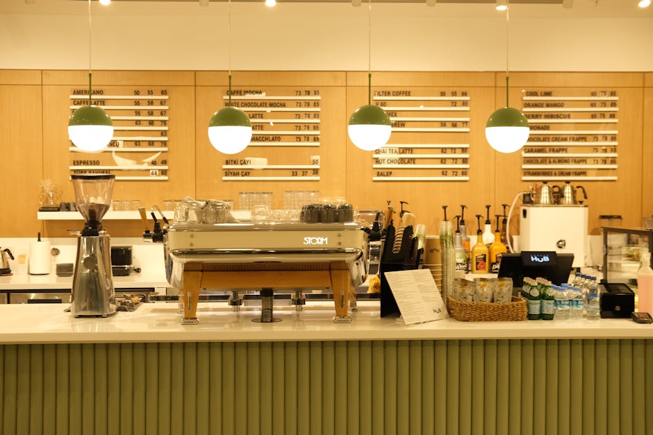 Inviting coffee shop counter showcasing coffee machine, menu board, and cozy ambiance.